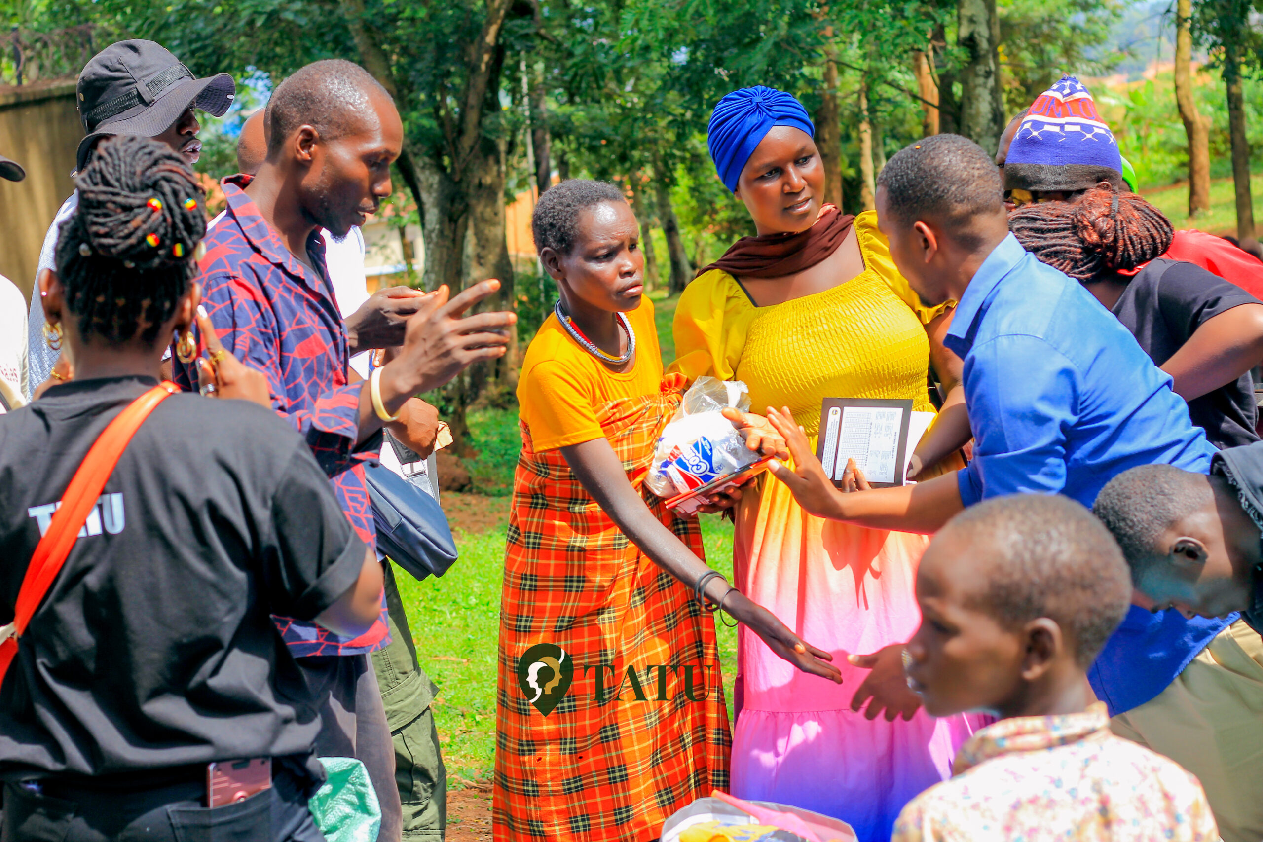 Distribution of scholastic items to pupils in jinja tourism host village by Tatu a charitable travel community in the pearl of Africa